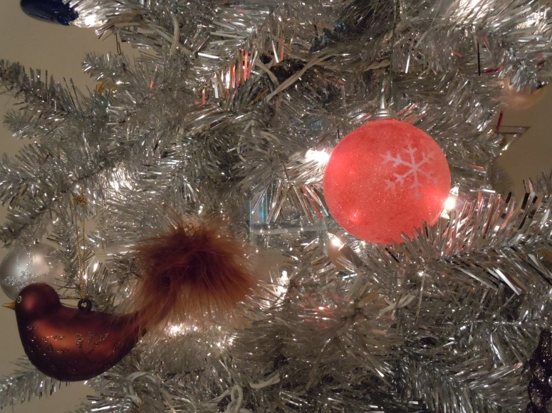 Santa loves our silver tree.